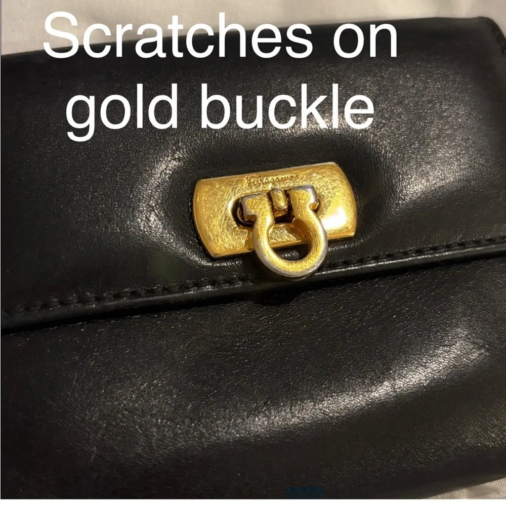 Authentic Ferragamo black leather trifold wallet gold with callouts